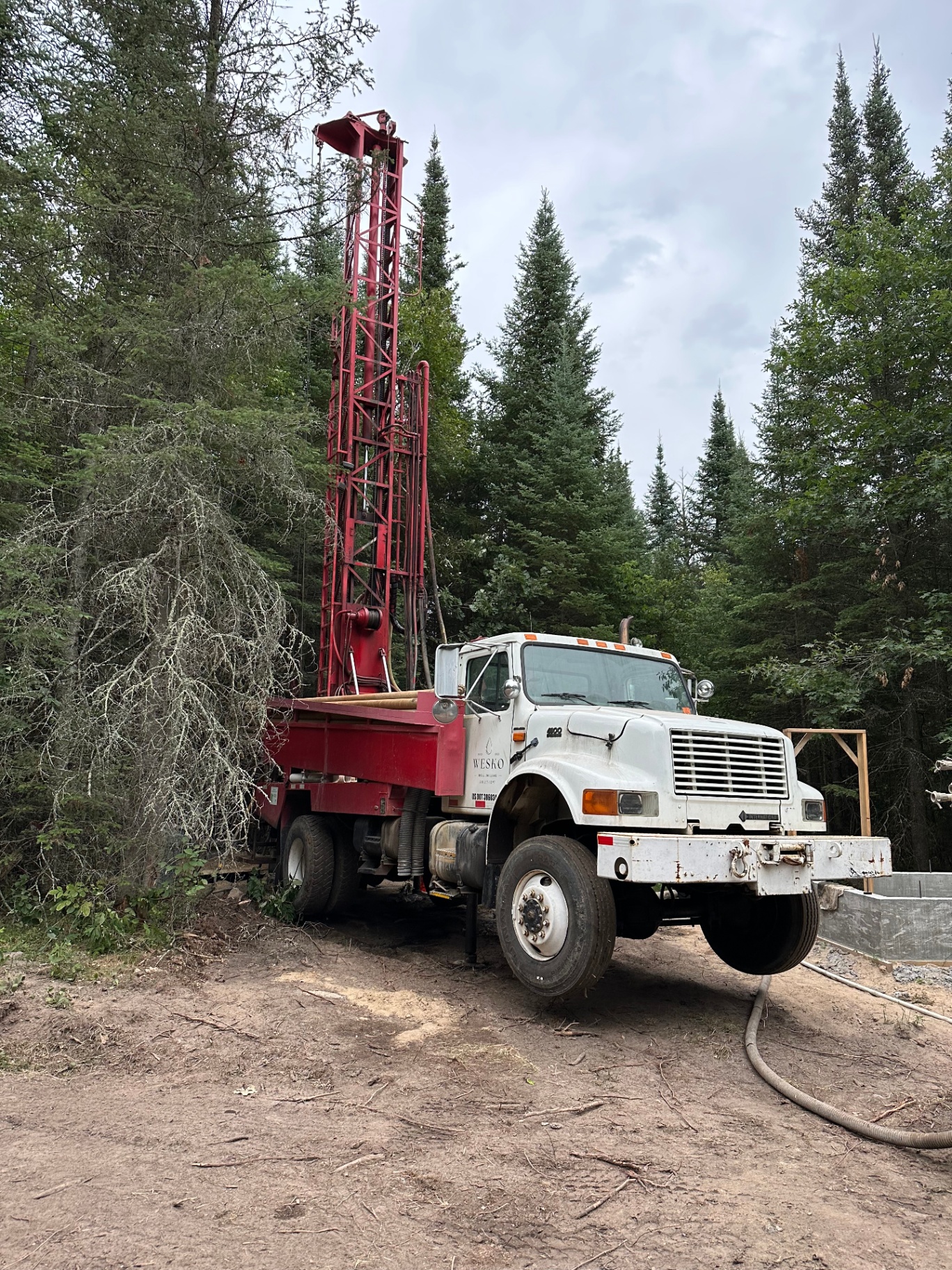 WESKO drill truck at a wooded job site